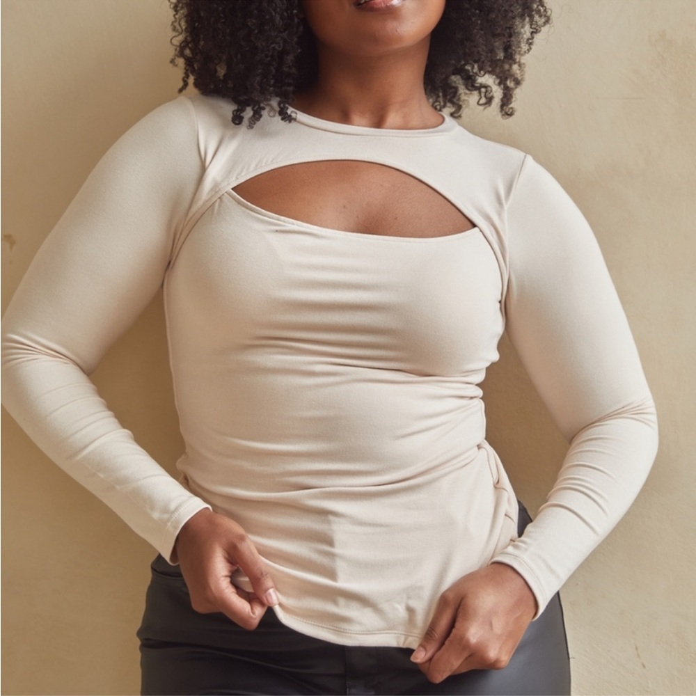 NWT in bag. Size XS. Peekaboo long sleeve. Cream. Braless. Klassy network